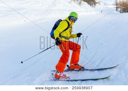 Image Of Sports Man Skiing On Snowy Slope During Day