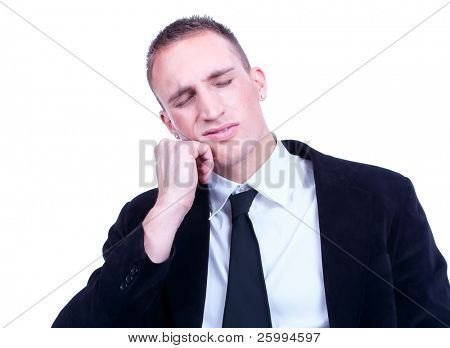 Young business man with a teethache against a white background