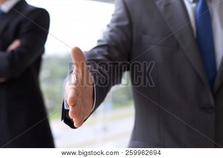 Unknown Business Man Offering Handshake While Standing Straight. Success Cooperation And Agreement C