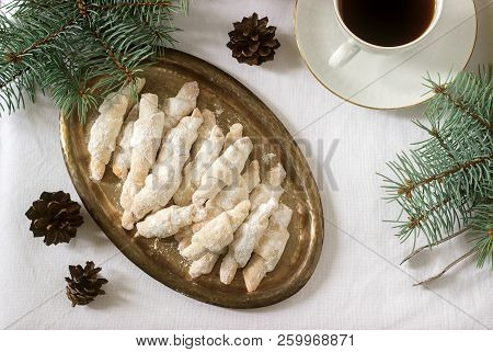 Traditional Romanian Or Moldovan Shortcake Cookies With Jam Stuffing And A Cup Of Tea On The Backgro
