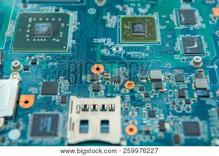 Computer Motherboard Cpu Board Blue Processor. Technology Background With Microelectronics Texture H