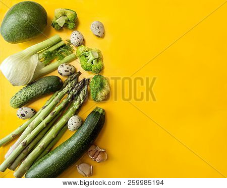 Fresh Organic Vegetales For Preparing Healthy Meal. Concept Green On Yellow. Flat Lay. Overhead.copy