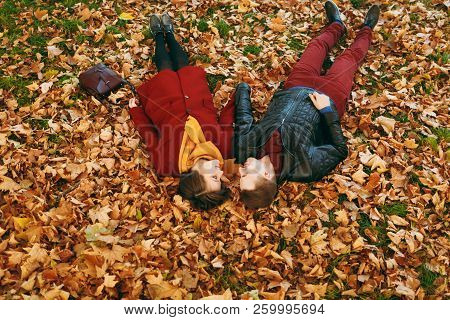 Young Romantic Couple In Love Woman And Man In Casual Warm Clothes Holding Hands Looking At Each Oth