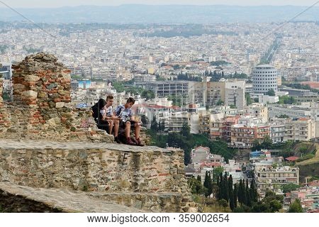 Thessaloniki, Greees - May 11: The Teenagers Are Sitting On Wall Of Trigonion Tower On May 11, 2016 