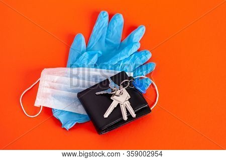 Medical Mask And Gloves Lie With Keys On A Background Of Lush Lava Color