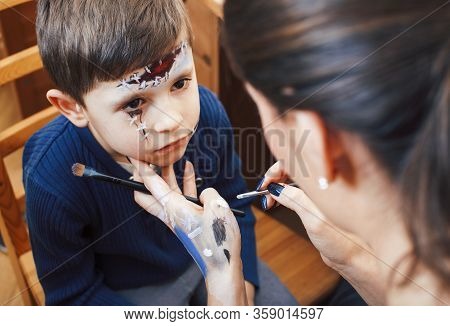Little Cute Child Making Facepaint On Birthday Party, Zombie Apocalypse Facepainting, Halloween Prep
