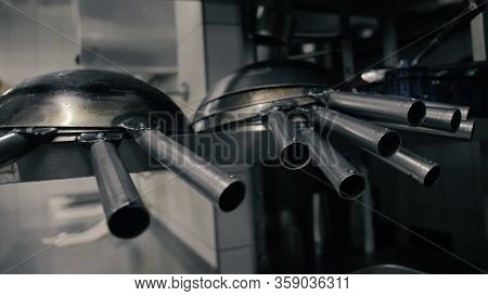 Wok Pans On The Shelf In The Kitchen