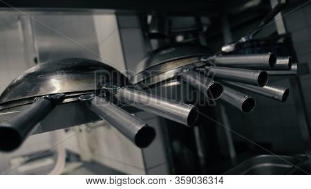 Wok Pans On The Shelf In The Kitchen