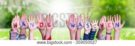 Kids Hands Holding Word Haende Waschen Means Wash Your Hands, Grass Meadow
