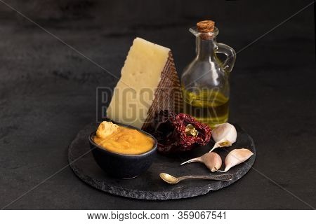 Almogrote, Famous La Gomera Cheese Paste, In Black Ceramic Bowl On Background. Its Appetizer In Many