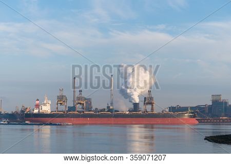 Ijmuiden, Netherlands - October 6, 2018: Large Cargo Ship Moored In Front Of Tata Steel Company