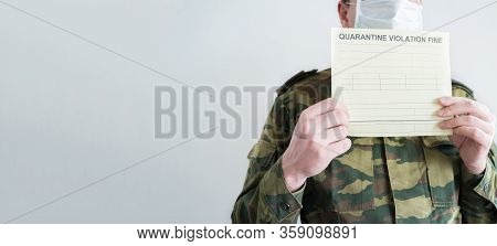 Police Officer With Handcuffs In Khaki Colored Uniform Stops People On The Street For Violating Rule