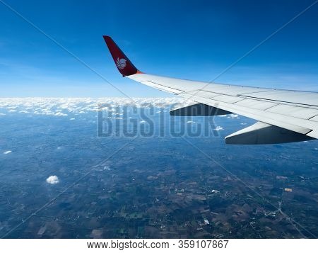 Chiang Rai, Thailand - November 12 2020: A Thai Lion Air Plane Flies Over The Northern Region Of Tha