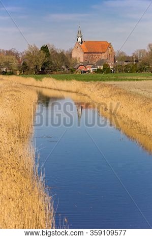 Small Town Holwierde In A Typical Dutch Landscape Near Appingedam, Netherlands