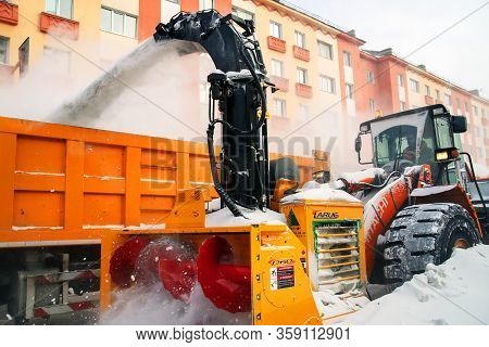 Norilsk, Russia - March 23, 2020: Closeup Of The Snow Impeller Of An Orange Snow Blower.