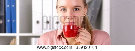 Girl Sits Office Front Computer And Drinks Coffee. Chosen Profession Is Overloaded With High Competi