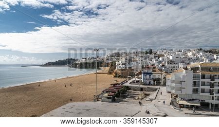 Albufeira, Algarve, Portugal, February 2020 - View Of The Beach And Old Town  In Albufeira, Algarve,