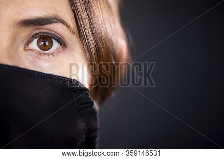Young Woman Wearing A Protective Black Leather Face Mask During The Coronavirus Disease Covid-19 Out