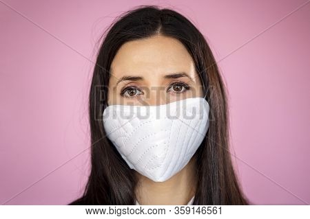 Young Woman Wearing A Protective Face Mask During The Coronavirus Disease Covid-19 Outbreak Epidemic