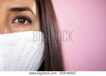 Young Woman Wearing A Protective Face Mask During The Coronavirus Disease Covid-19 Outbreak Epidemic