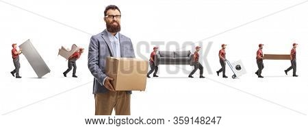 Bearded man holding a cardboard box and workers carrying home appliences and furniture in the back isolated on white background