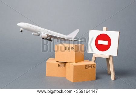 Cargo Plane With Boxes And An Easel With A Restriction Sign. Restrictions On Export Of Scarce And Me