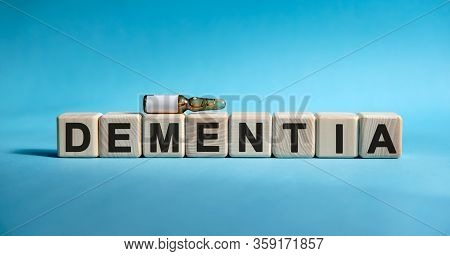 Dementia - Text On Cubes. Drug In Ambula To Reduce Disease Symptoms On A Blue Background