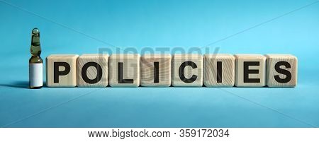 Policies - Word On Cubes. Drug In Ambula To Reduce Disease Symptoms On A Blue Background