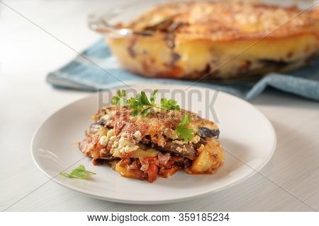 Moussaka, Traditional Greek Baked Casserole Of Eggplants, Potatoes, Minced Meat And Tomatoes Served 