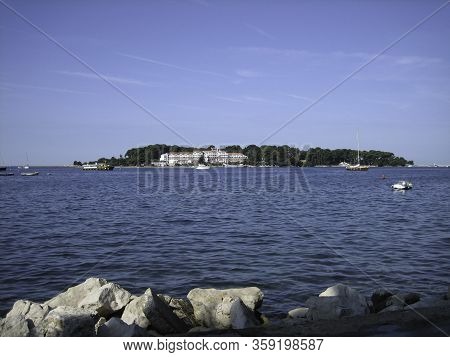View From The Shore To The Island Where There Is A Beautiful Large House. On The Blue Water Of The B