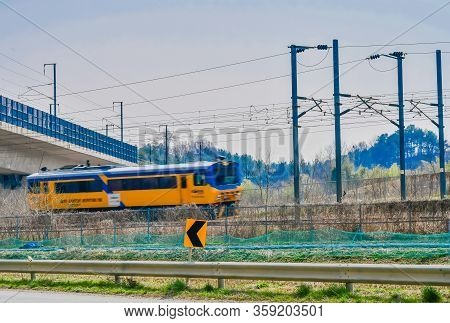 Daejeon,south Korea; April 1, 2020: Yellow And Blue Train Track Inspection Car Traveling Through Cou