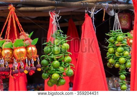 Small Golden Copper Buckets, Leaves, Coconuts, Worship Strings, Green Lemon And Green Chiili And Red