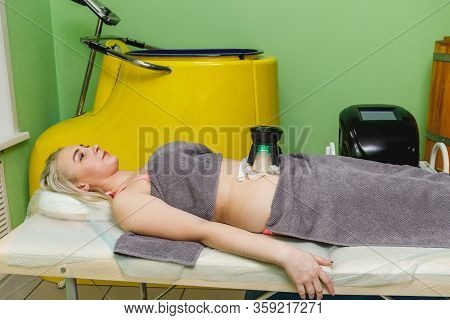 Woman Getting Cryolipolysis Fat Treatment Procedure In Beauty Salon