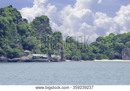 Wooden Houses Built On Rocks In The Koh Maphrao At Chumphon In Thailand.