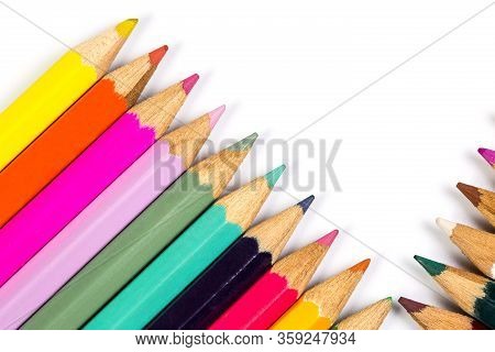 Colored Wooden Sharpened Pencils For Office And School On A White Background