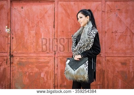 High Fashion Portrait Of Young Elegant Woman Outdoor. Brick Wall, Bag, Bijoux, Glamour Outfit. Backg