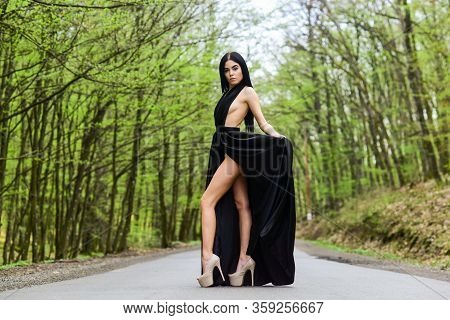 Sexy Girl Elegant Dress High Heels At Road. Beauty And Fashion. Woman In Black Dress. Elegant Lady. 