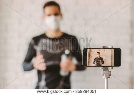 Filming Online Classes With Confident Professional Fitness Trainer. Exercising At Home During Corona