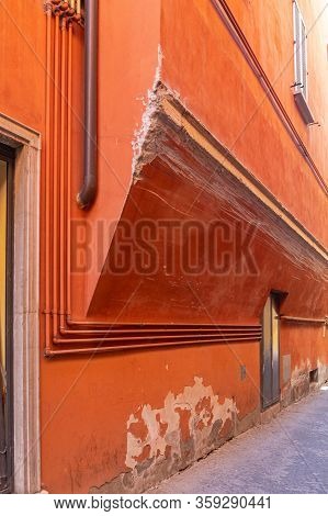 Damaged House Wall Scratched By Vehicle In Narrow Street
