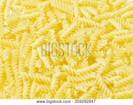 Pile Of Small Vegeroni Rotini Spirals Pasta On White Background