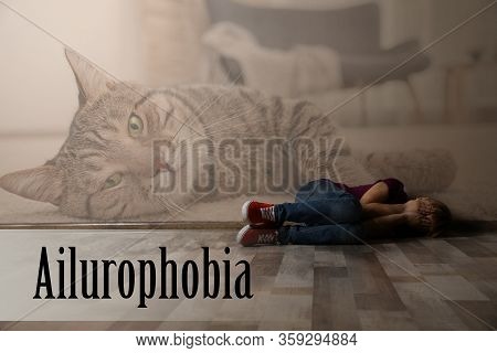 Scared Little Girl Lying On Floor Indoors. Suffering From Ailurophobia (irrational Fear Of Cats)