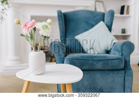 Close-up Image Of Nice Flowers In Vase On A Tea Table In A Cozy Decorated Room