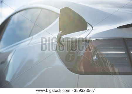 Ev Electric Car Pluged Charging At A Recharge Station In The City