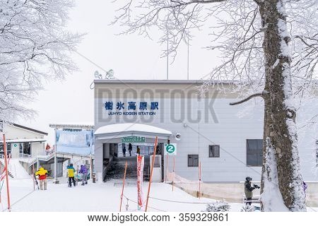 People Are Traveling Onto Utopia Skii Slope In Zao Mountain.