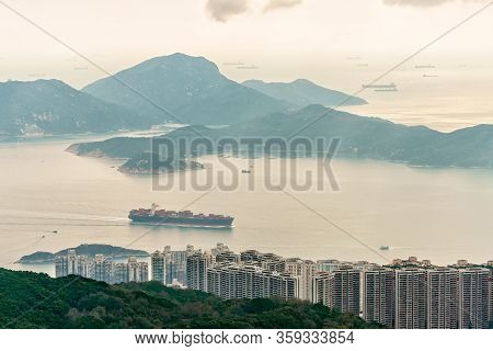 Lamma Island Viewed From Victoria Peak On Hong Kong Island In Hong Kong. Container Vessel Transports