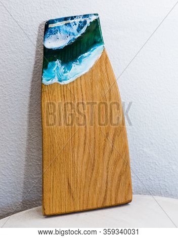 Part of original epoxy resin art close up lacing on wood
