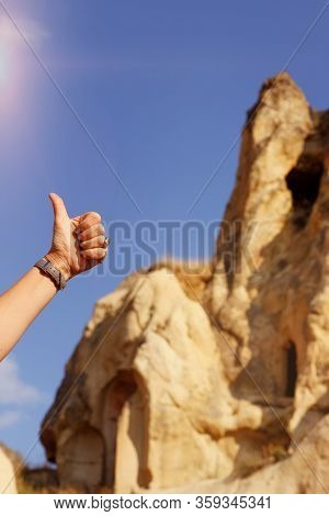 Women Thumb Up On The Background Of Pyramids Of Cappadocia