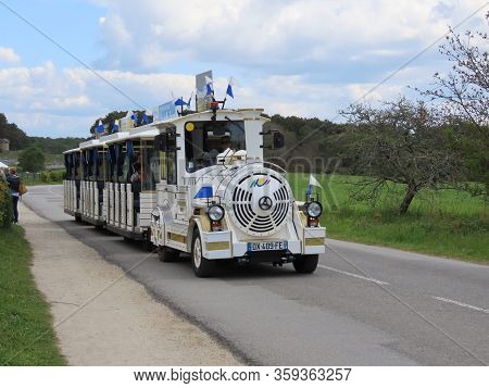 Carnac, Brittany, France - May 5, 2019: Small White Tourist Train In Carnac Megalith Alignment Site