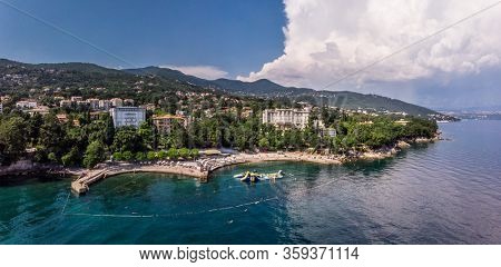 Beautiful panoramic view of Lovran village and its sea shore in Croatia. Top view photo taken on drone.