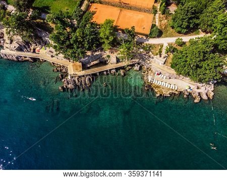 Beautiful panoramic view of Lovran village and its sea shore in Croatia. Top view photo taken on drone.